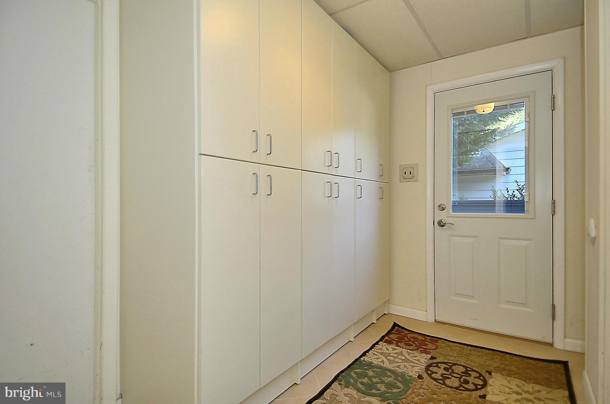 10104 Kohler Road Silver Spring, MD 20902 - Photo 18 of 30 MUDROOM WITH BUILT IN STORAGE AND TILE FLOOR
