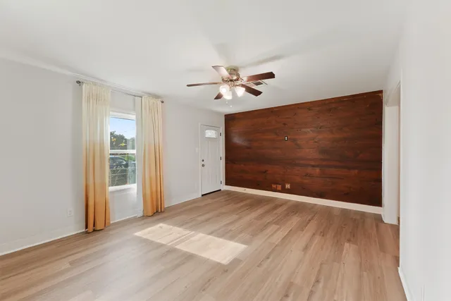 a view of an empty room with a window