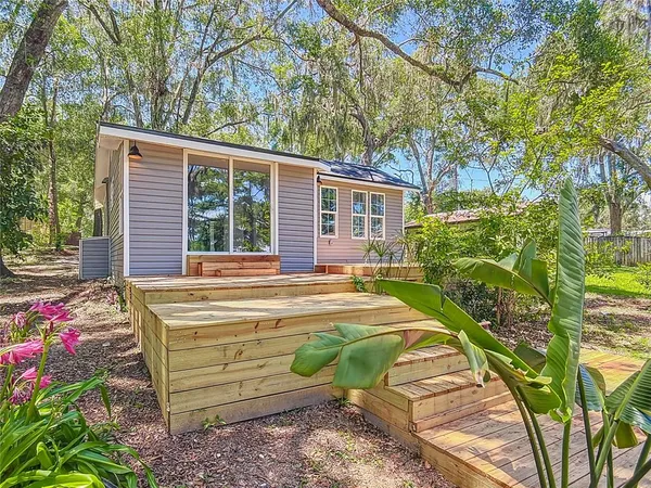 a house with a tree in the background