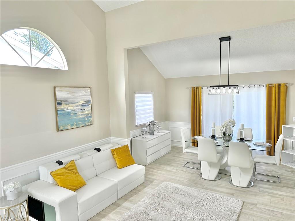 3639 Kent Drive Naples, FL 34112 - Photo 11 of 47 a living room with furniture and wooden floor