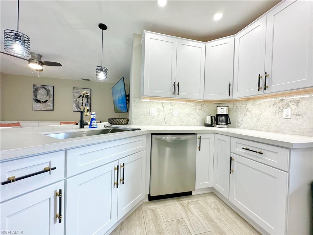 3639 Kent Drive Naples, FL 34112 - Photo 15 of 47 a kitchen with a sink cabinets and window