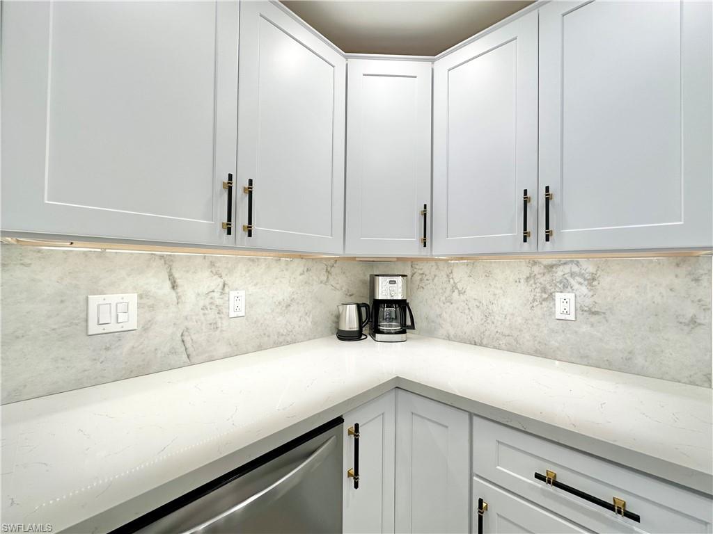 3639 Kent Drive Naples, FL 34112 - Photo 18 of 47 a kitchen with a sink and cabinets