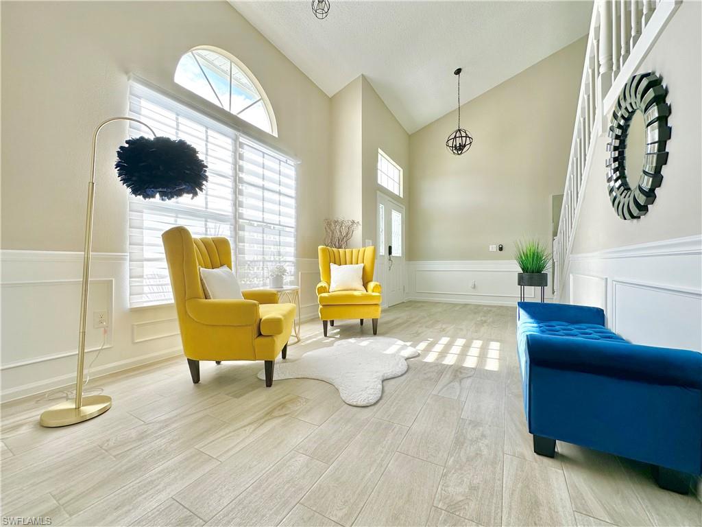 3639 Kent Drive Naples, FL 34112 - Photo 2 of 47 a living room with furniture and a flat screen tv