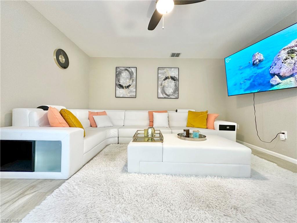 3639 Kent Drive Naples, FL 34112 - Photo 21 of 47 a bedroom with a bed and wall painting