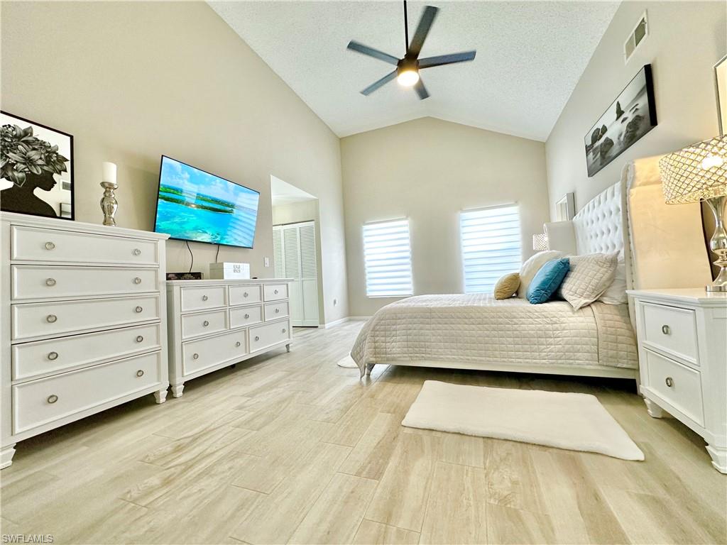 3639 Kent Drive Naples, FL 34112 - Photo 26 of 47 a bedroom with a bed and a dresser