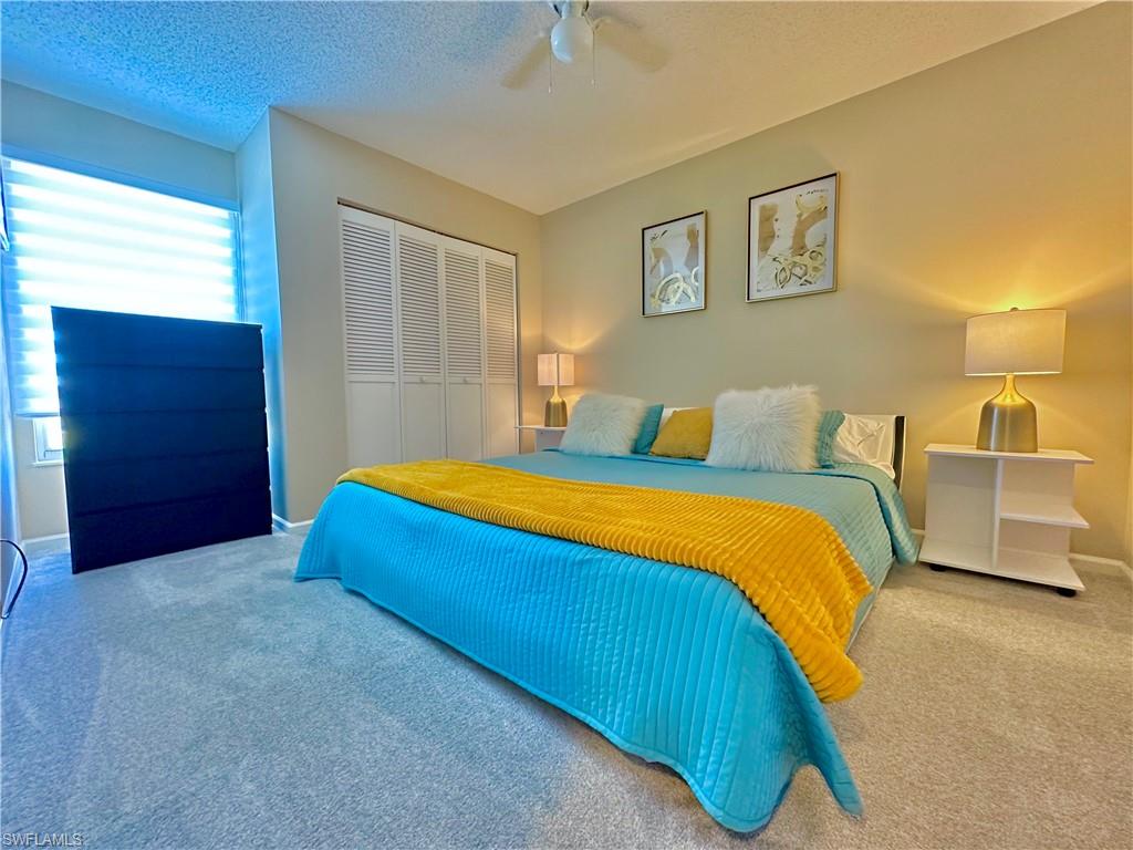 3639 Kent Drive Naples, FL 34112 - Photo 33 of 47 a bedroom with a bed and painting on the wall