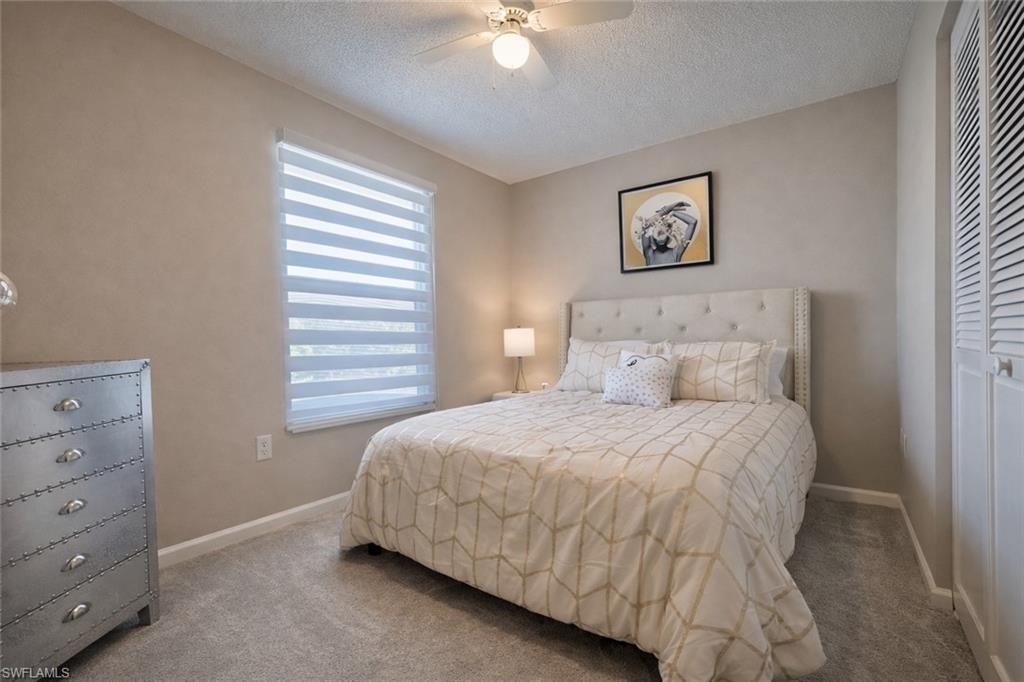 3639 Kent Drive Naples, FL 34112 - Photo 38 of 39 a bedroom with a bed and a window