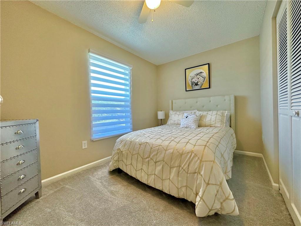 3639 Kent Drive Naples, FL 34112 - Photo 39 of 47 a bedroom with a bed and a window
