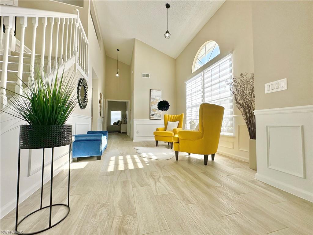 3639 Kent Drive Naples, FL 34112 - Photo 5 of 39 a living room with furniture and a fireplace