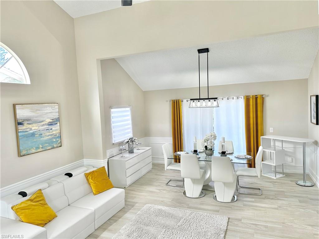 3639 Kent Drive Naples, FL 34112 - Photo 7 of 39 a living room with furniture and wooden floor