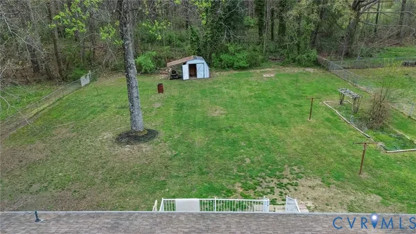 a view of a tiny house with a yard
