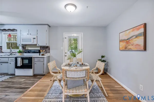 a dining room with furniture and window