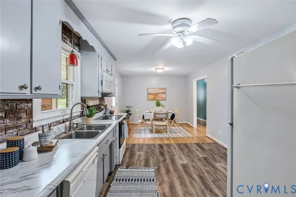 a very nice looking kitchen with a large window