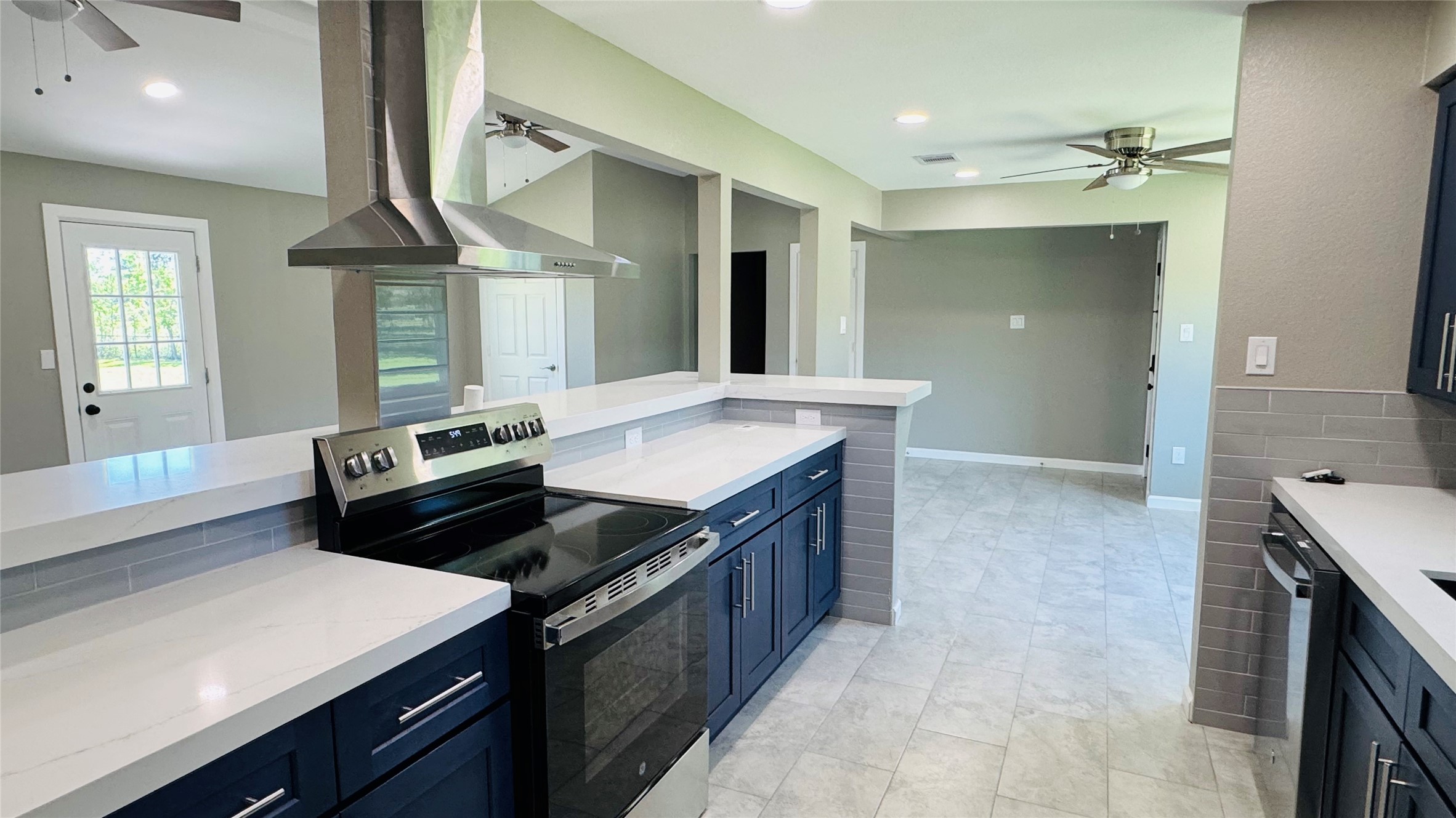 1434 County Road 878A Sweeny, TX 77480 - Photo 13 of 36 a kitchen with a stove cabinets and wooden floor