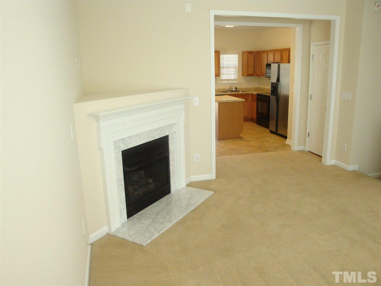 2204 Persimmon Ridge Drive Raleigh, NC 27604 - Photo 7 of 21 a view of a livingroom with a fireplace