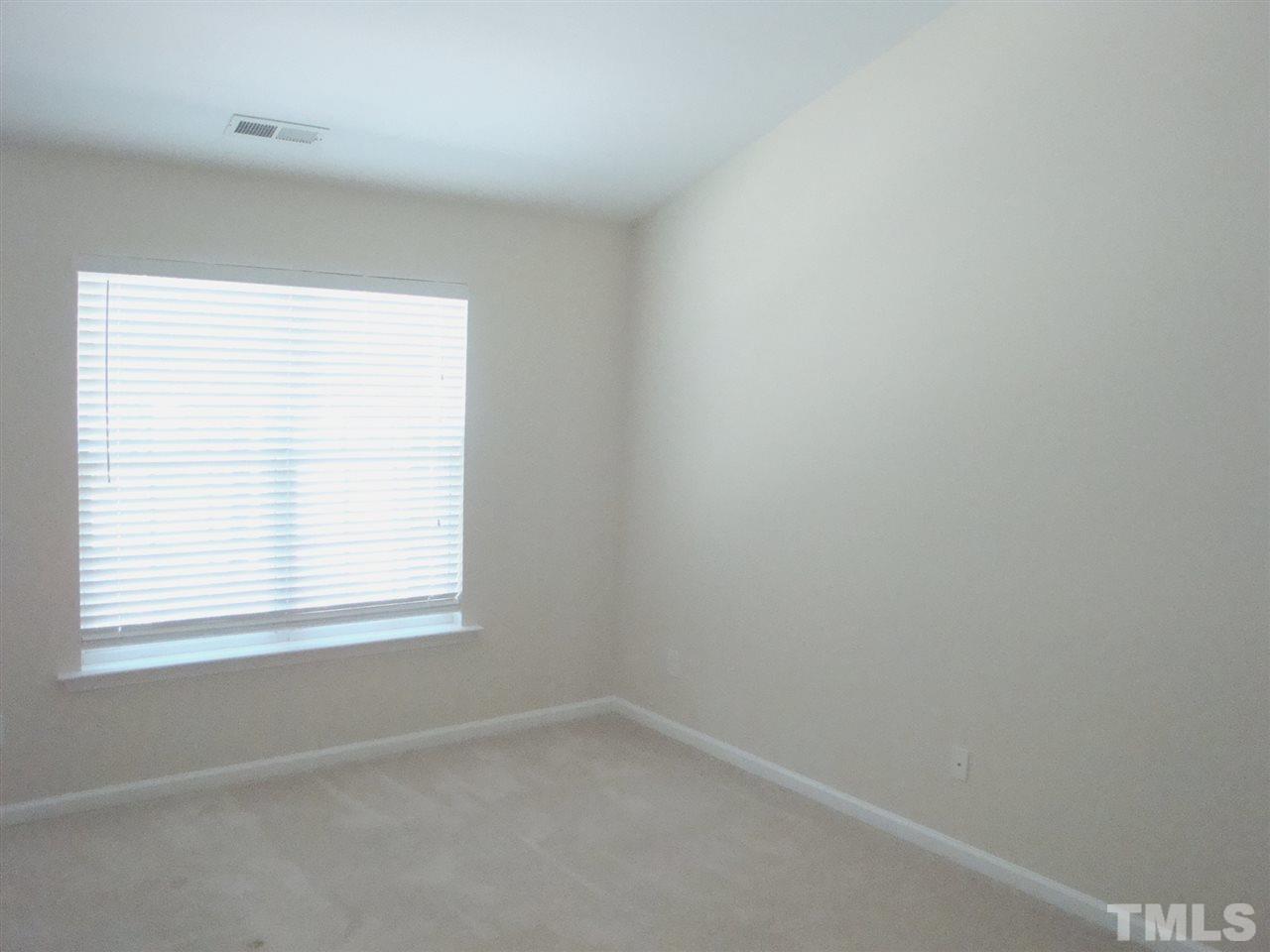2204 Persimmon Ridge Drive Raleigh, NC 27604 - Photo 9 of 21 an empty room with a window