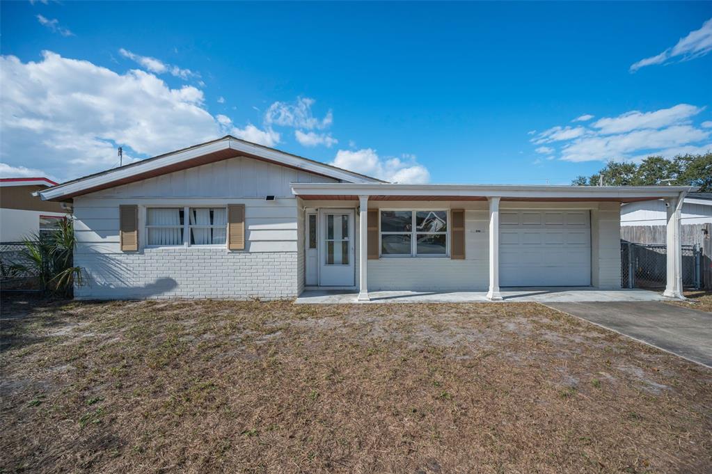 4607 Pirate Place New Port Richey, FL 34652 - Photo 1 of 1 front view of house with a yard