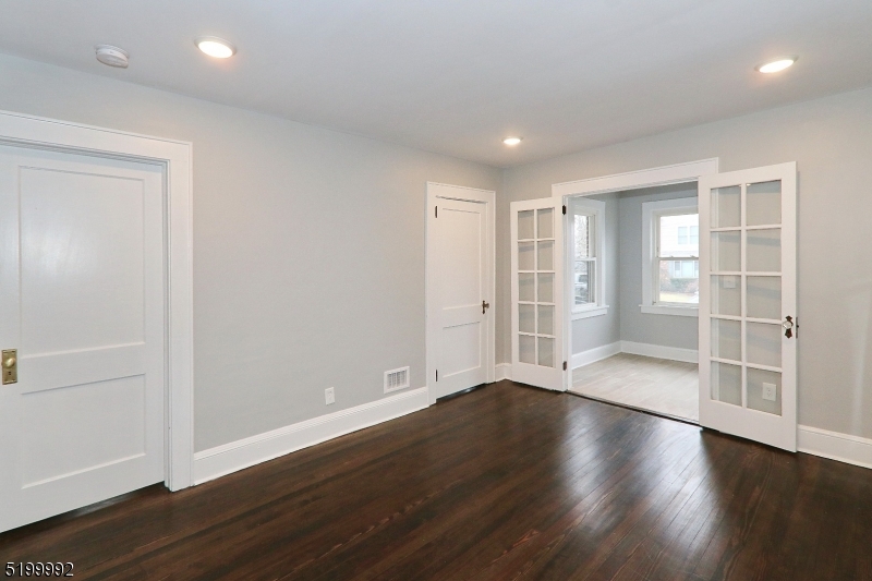 4 Gates Avenue, Unit A Summit, NJ 07901 - Photo 4 of 19 an empty room with wooden floor & closet and windows