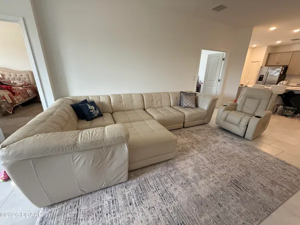 a living room with furniture and a couch