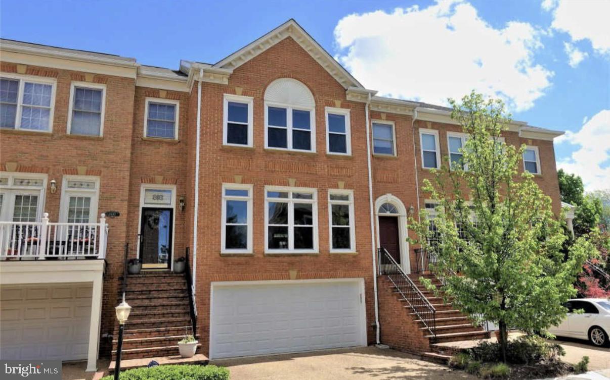 1847 Brenthill Court Vienna, VA 22182 - Photo 1 of 26 a front view of a house with a yard