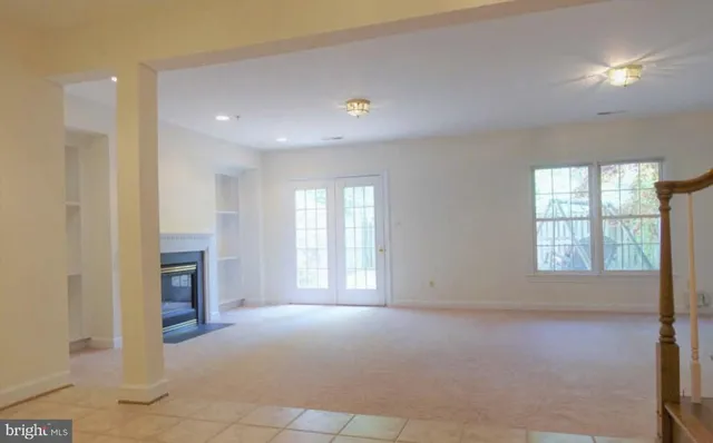 a view of an empty room with glass door