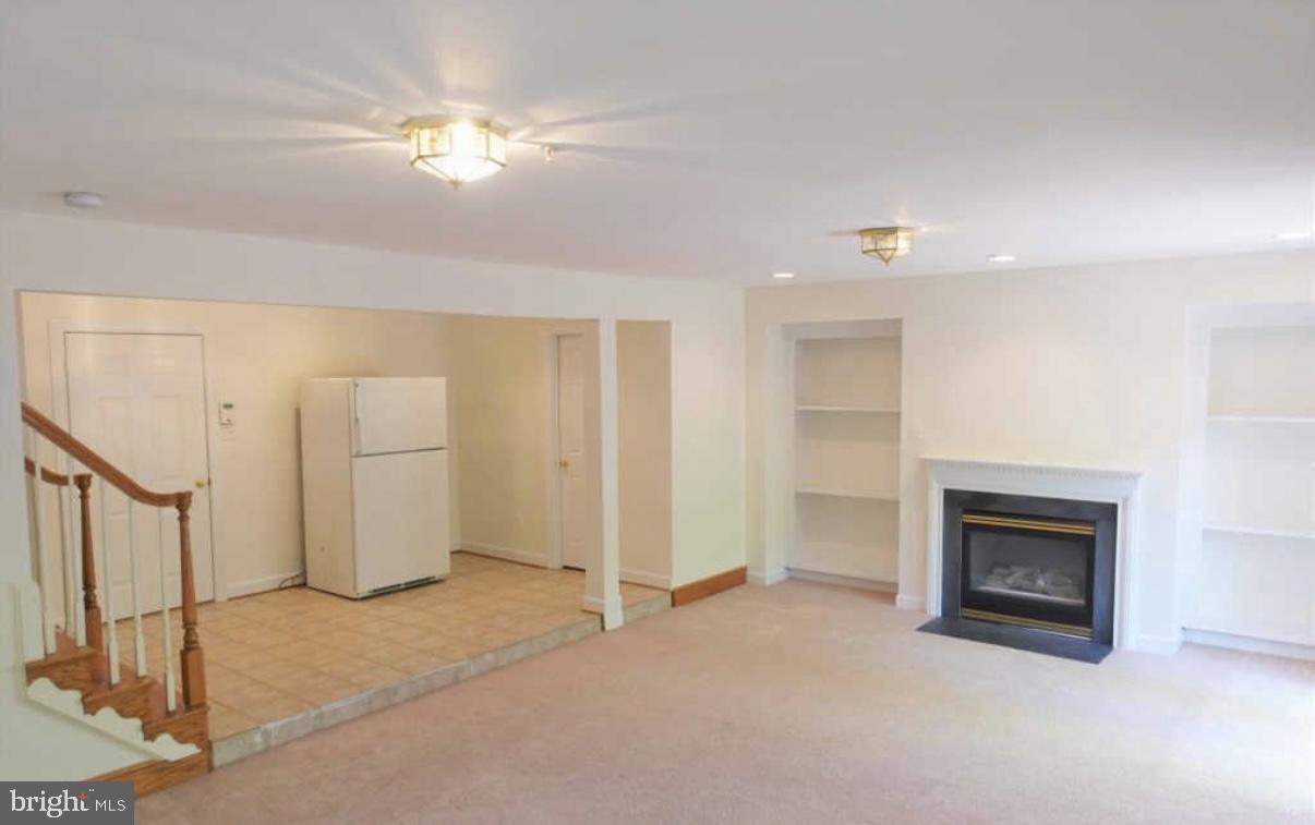 1847 Brenthill Court Vienna, VA 22182 - Photo 18 of 26 a view of a livingroom with a fireplace