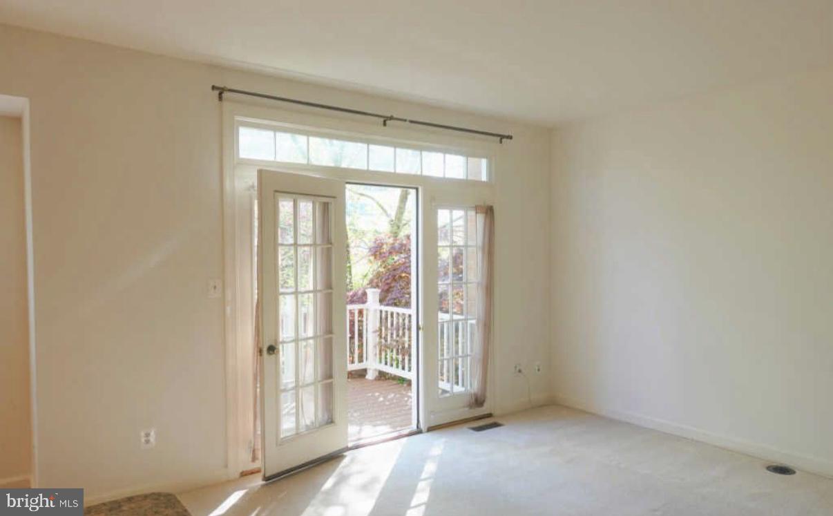 1847 Brenthill Court Vienna, VA 22182 - Photo 20 of 26 a view of an empty room with glass door
