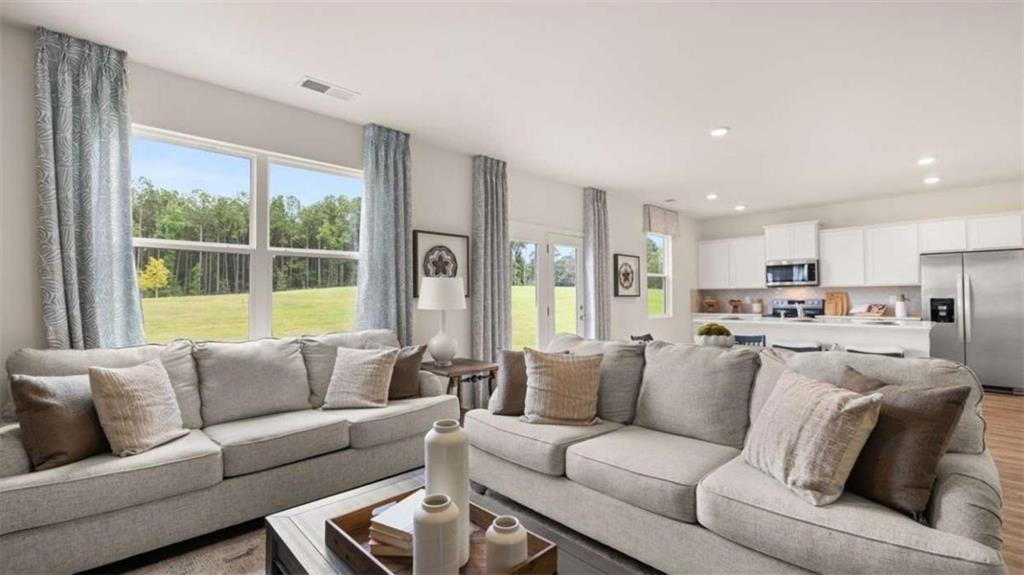 330 Friendship Oak Way Hampton, GA 30228 - Photo 14 of 41 a living room with furniture and a large window