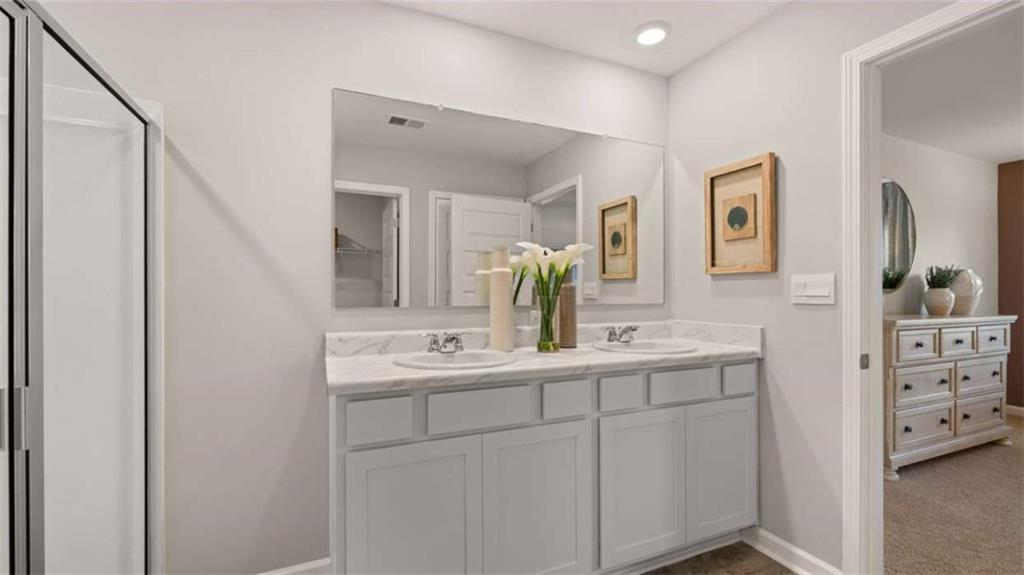 330 Friendship Oak Way Hampton, GA 30228 - Photo 22 of 41 a bathroom with a double vanity sink and mirror