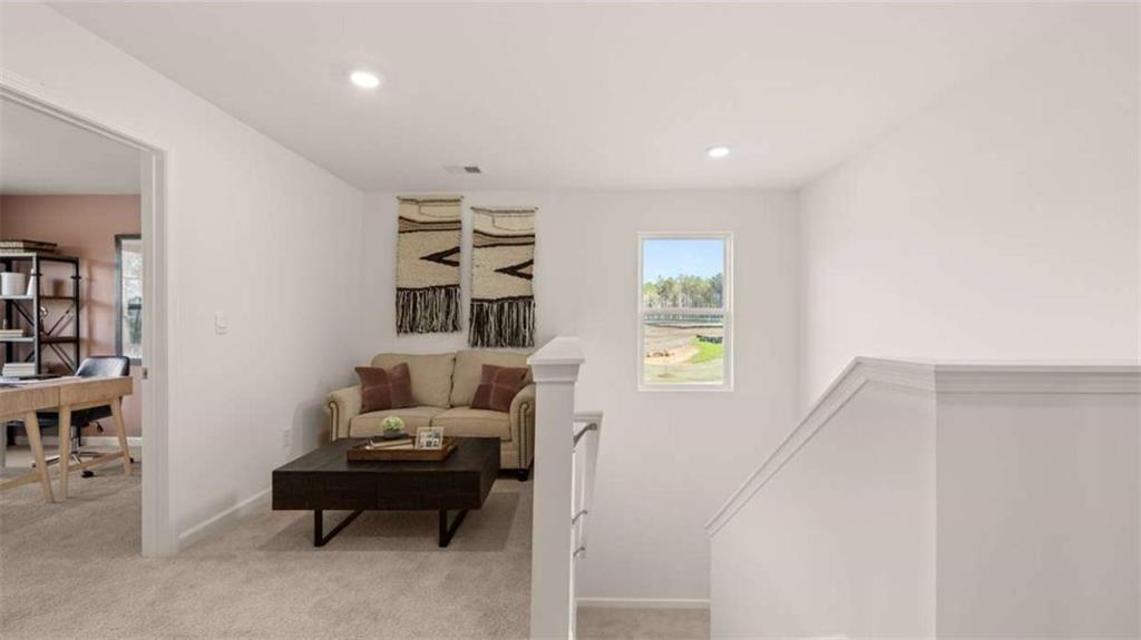 330 Friendship Oak Way Hampton, GA 30228 - Photo 25 of 41 a living room with furniture and a window