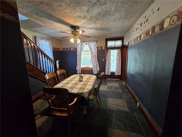 a dining room with furniture and window