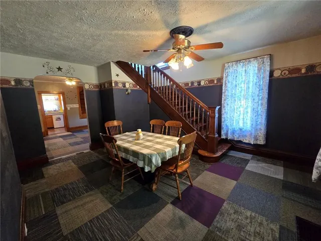 a balcony with table and chairs