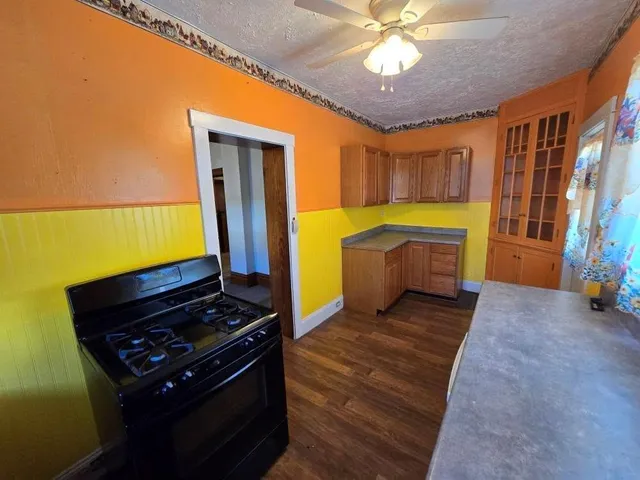 a kitchen that has a sink and a stove