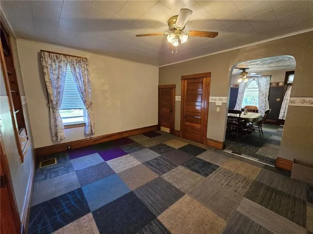 a living room with furniture and a rug