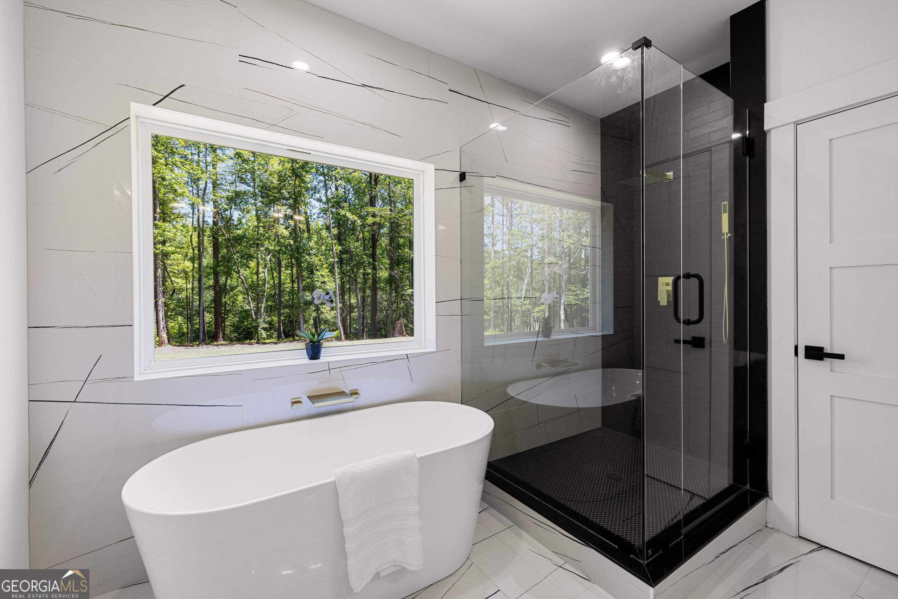 354 Turner Road Newnan, GA 30263 - Photo 41 of 79 a bathroom with a bathtub and shower