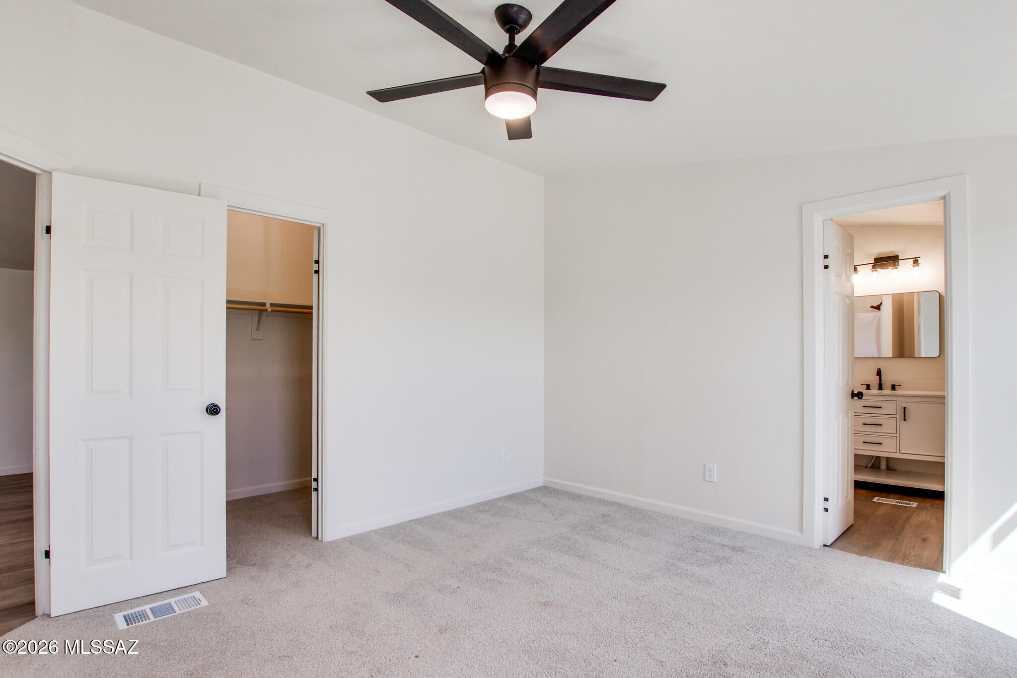 14303 West Rolina Lane Tucson, AZ 85736 - Photo 22 of 38 a view of a livingroom with a ceiling fan and entryway