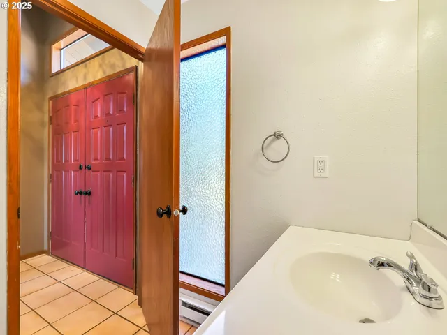 a bathroom with a tub and shower