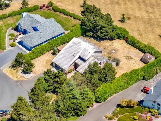 an aerial view of a house with a garden