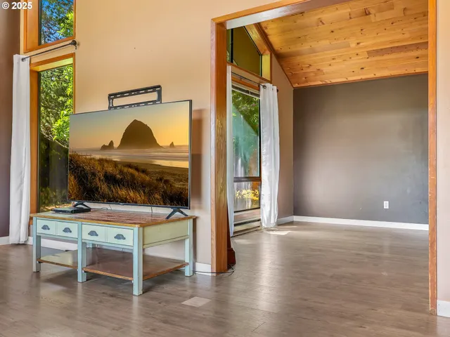a view of livingroom with furniture and a window