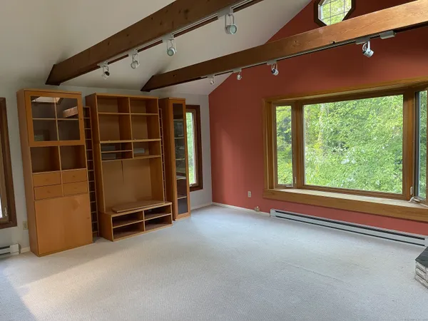 a view of an empty room with a window