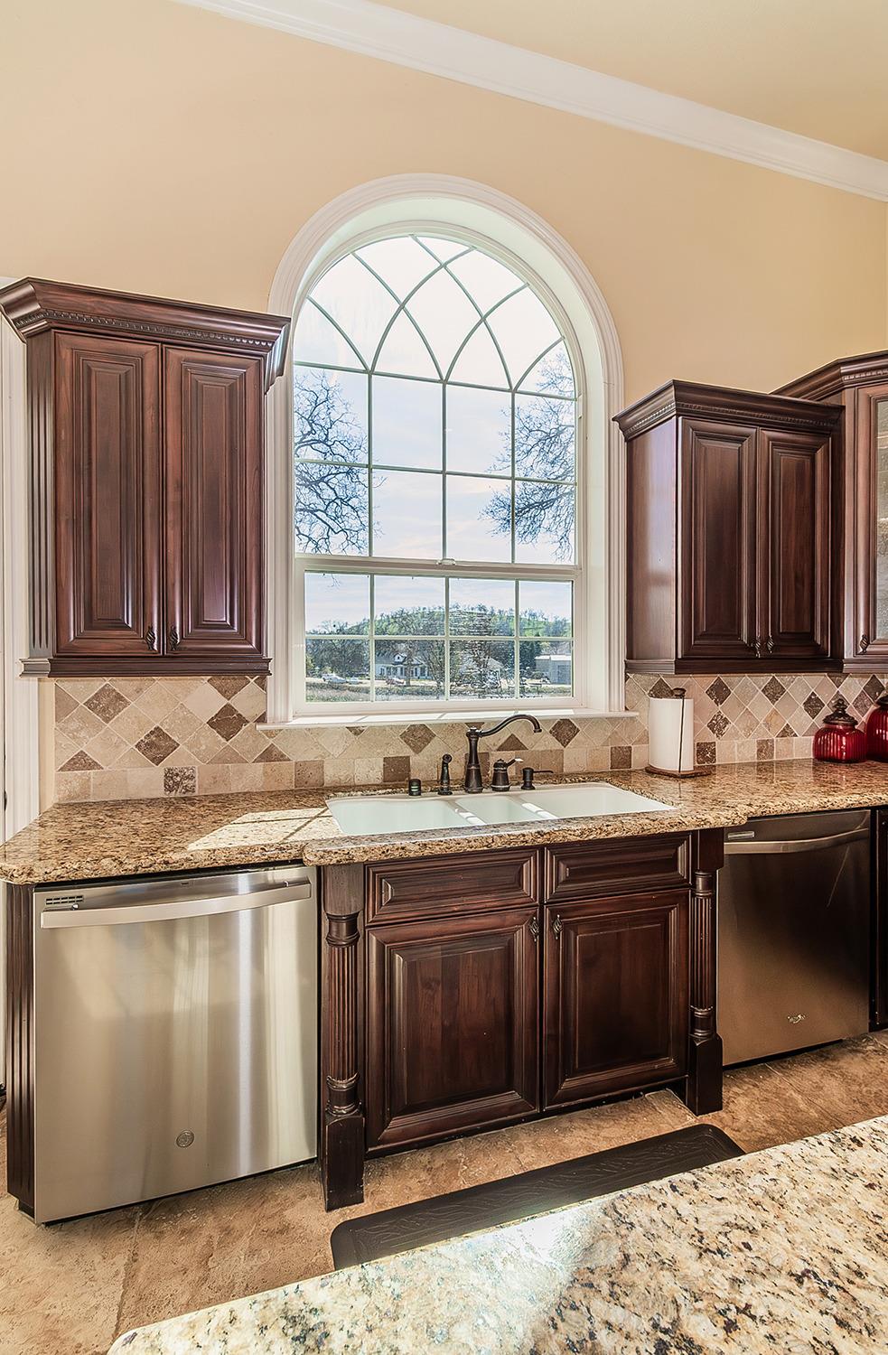 14505 Blue Drake Lane Prather, CA 93651 - Photo 52 of 87 a view of a kitchen with granite countertop a sink and a stove