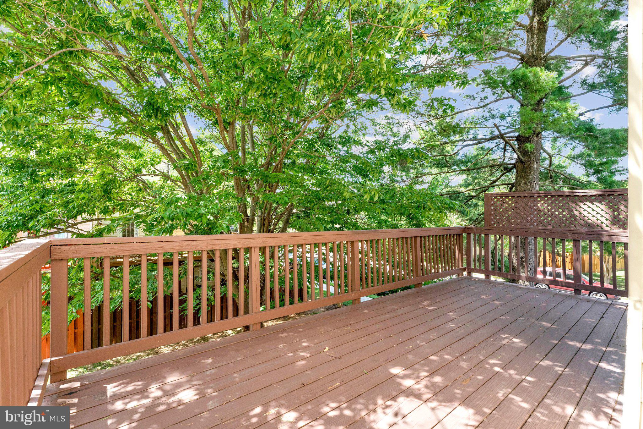 2000 Gallows Tree Lane Vienna, VA 22182 - Photo 47 of 58 a balcony with wooden floor and yard in the back