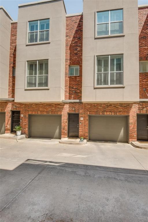 4307 McKinney Avenue, Unit 3 Dallas, TX 75205 - Photo 10 of 10 a front view of a house with a yard and a garage