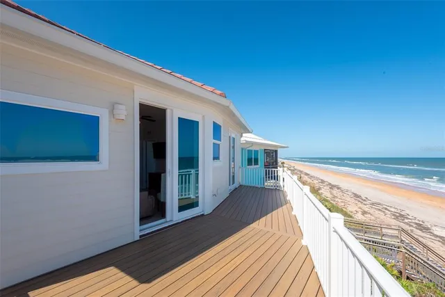 a view of balcony with wooden floor