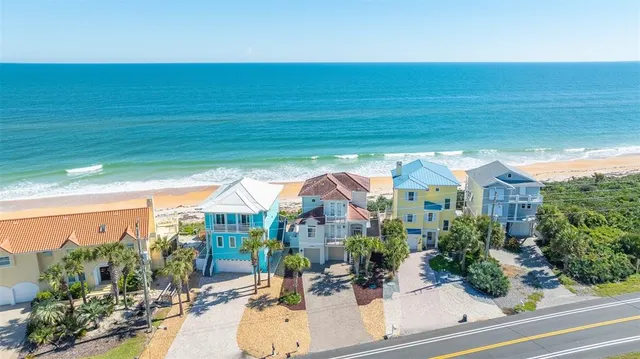 a front view of a residential apartment building with a yard