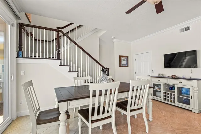 a view of a livingroom with furniture wooden floor and windows