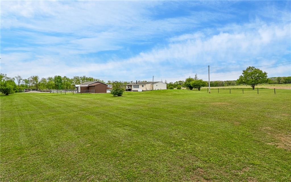 307 Hungarian Road Slippery Rock, PA 16057 - Photo 30 of 34 a view of a grassy field with an trees