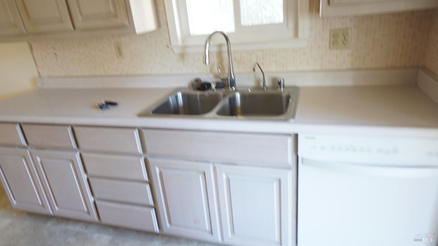2412 Foothill Boulevard, Unit 63 Calistoga, CA 94515 - Photo 9 of 28 Sink and cabinets, dishwasher