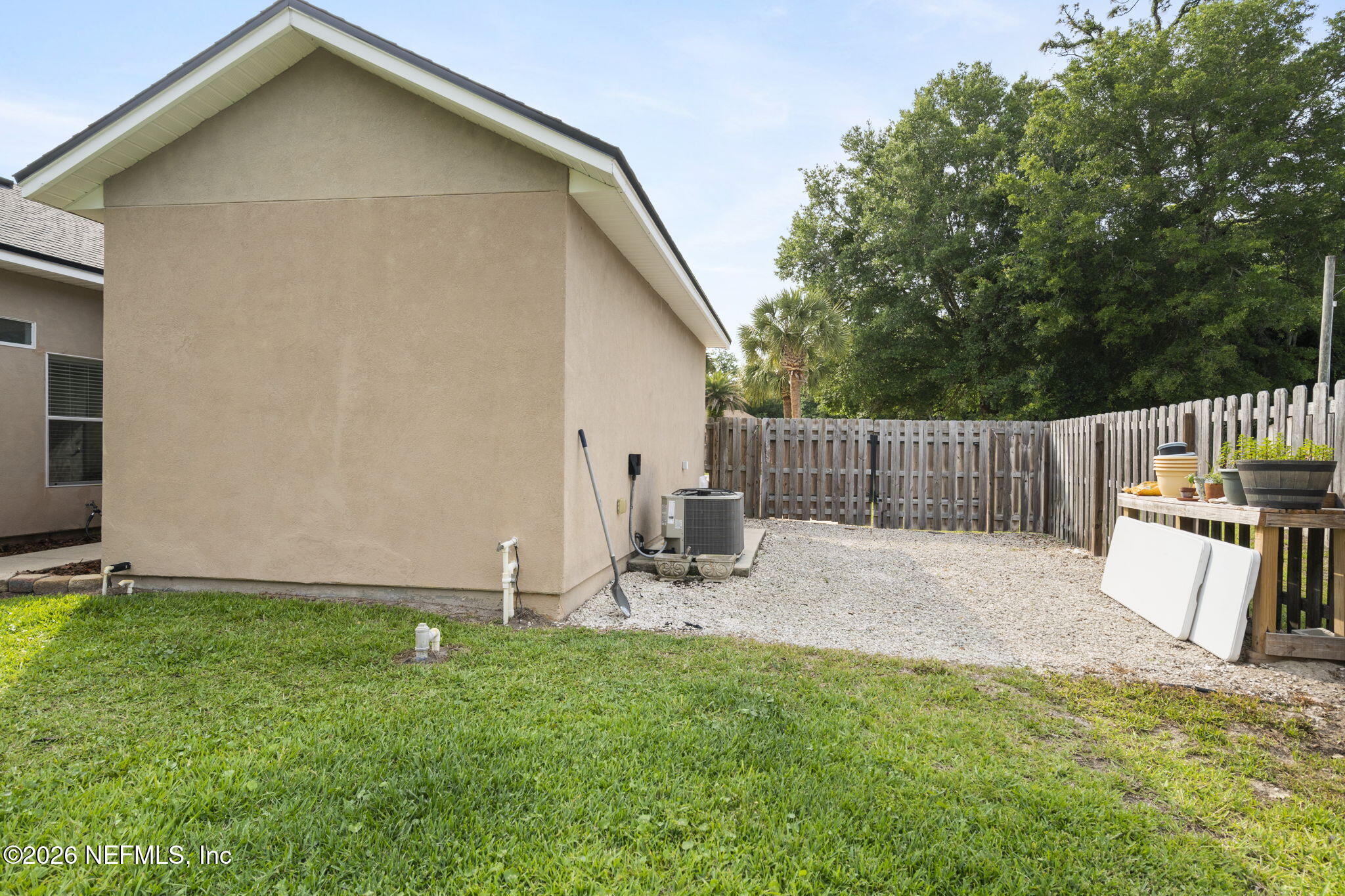 3296 Kings Road South St. Augustine, FL 32086 - Photo 33 of 39 a view of a backyard with a small cabin and wooden fence