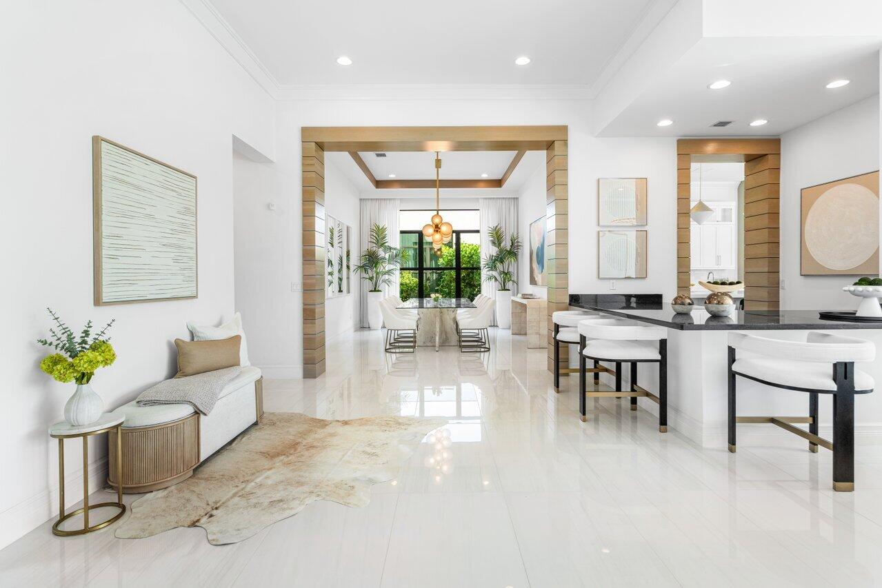 9276 Biaggio Road Boca Raton, FL 33496 - Photo 13 of 70 a living room with furniture a dining table and a potted plant